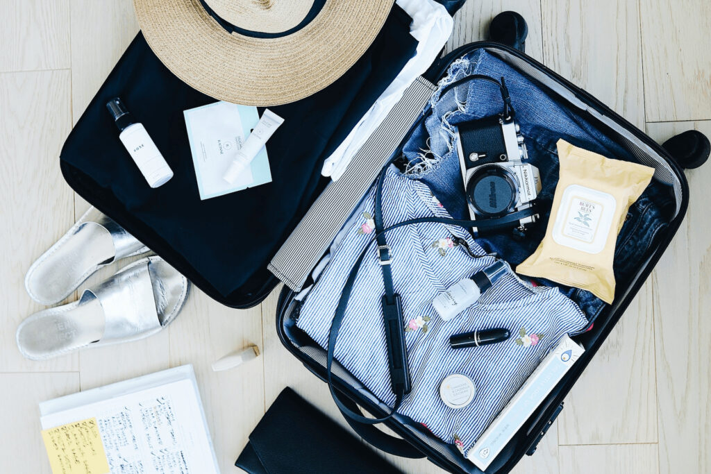 How To Pack a Suitcase - photo of clothes in a luggage