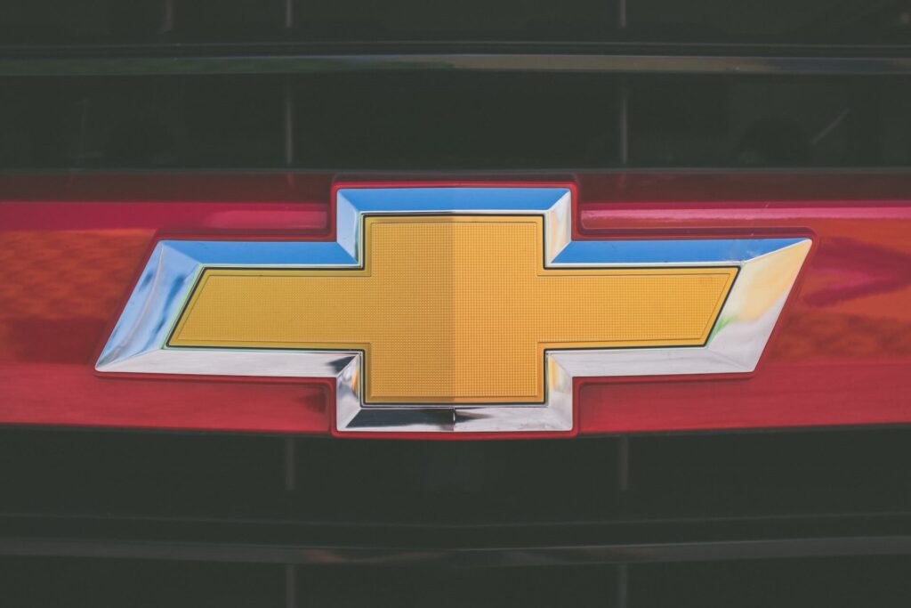 The golden Chevrolet logo with a red background.