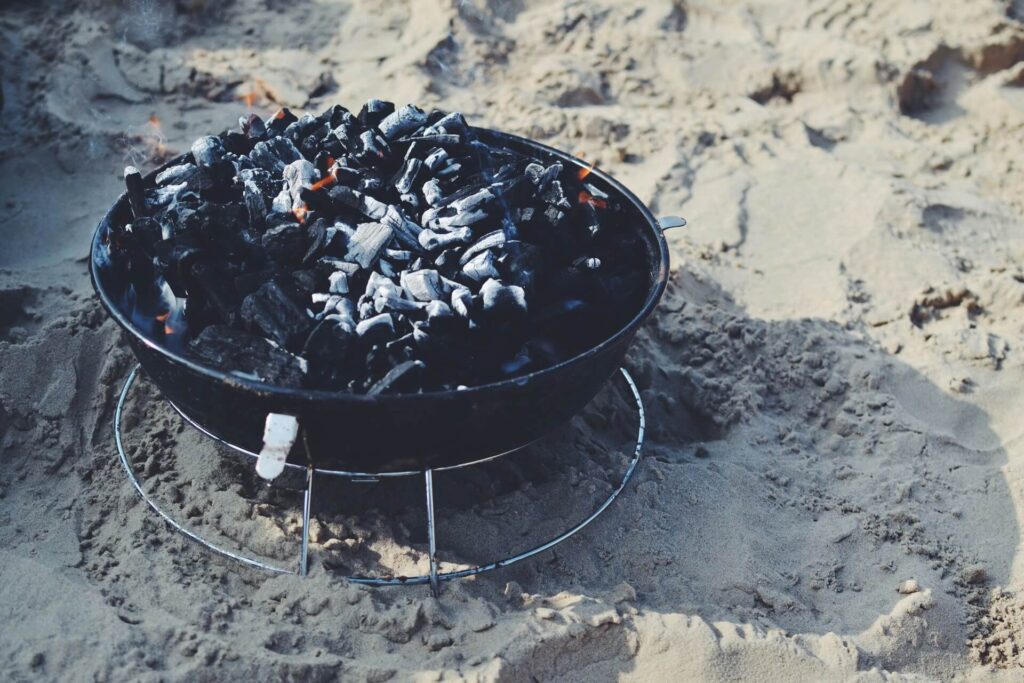 A portable fire pit with embers