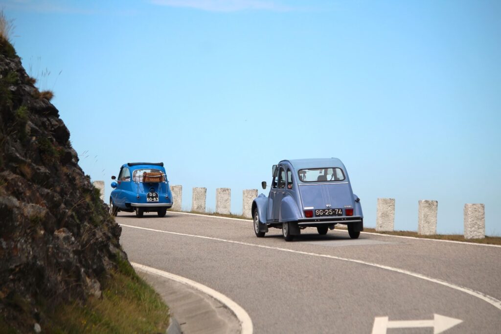 BMW Isetta drives up a mountain road in Portugal.