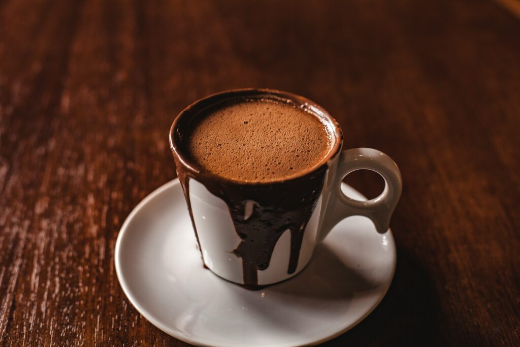 a mug of hot chocolate covered in melted chocolate