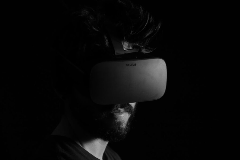 Greyscale image of a man wearing an Oculus headset