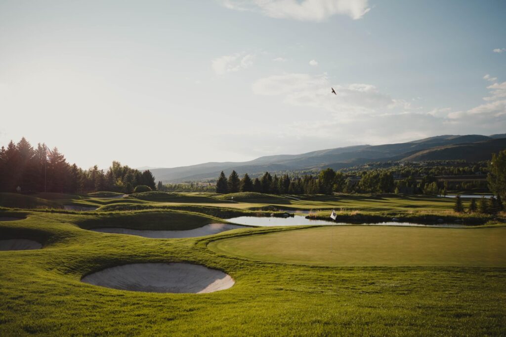 Scenic golf course with a backdrop of mountains