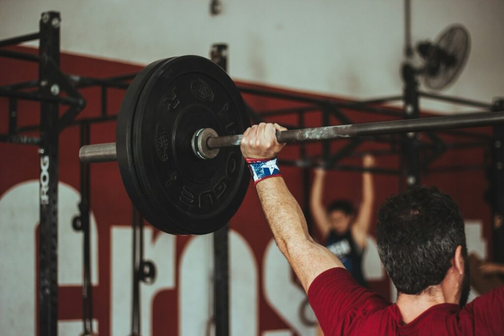 Man holding barbell in a snatch position