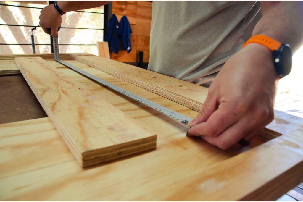 Man measuring a piece of wood