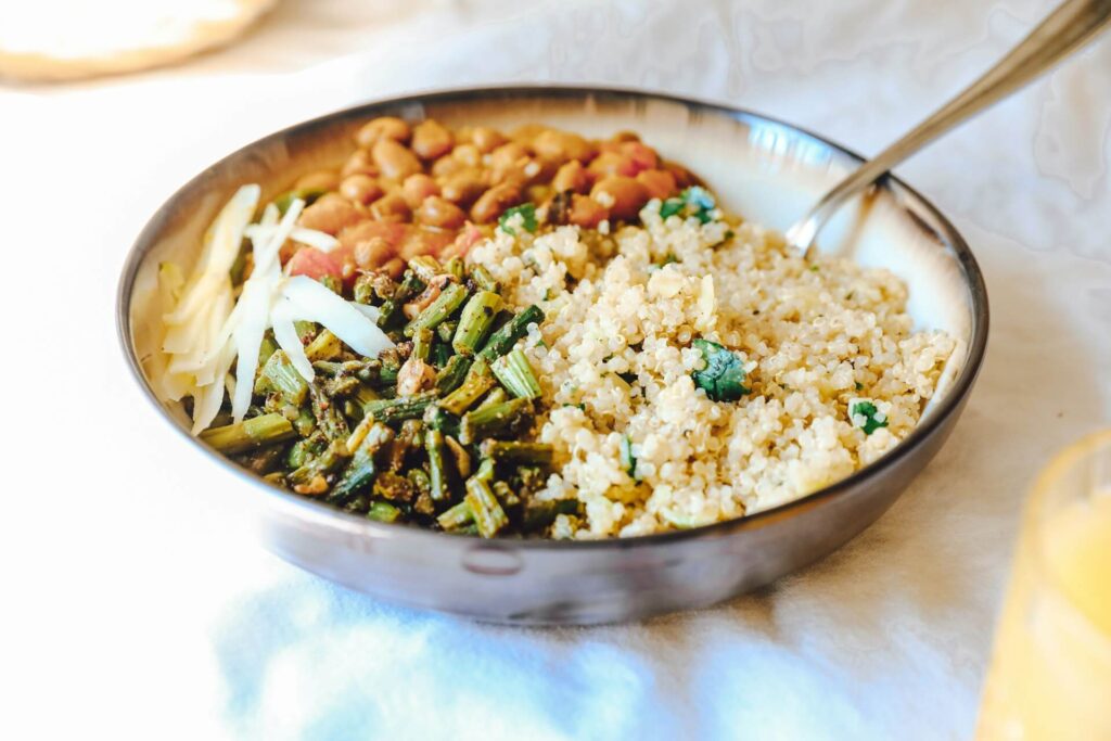 A bowl of quinoa, beans and vegetables