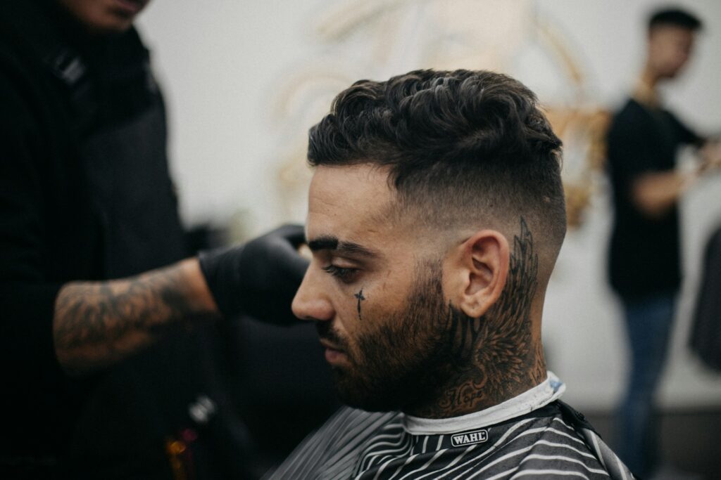 A man getting a fade at a barber