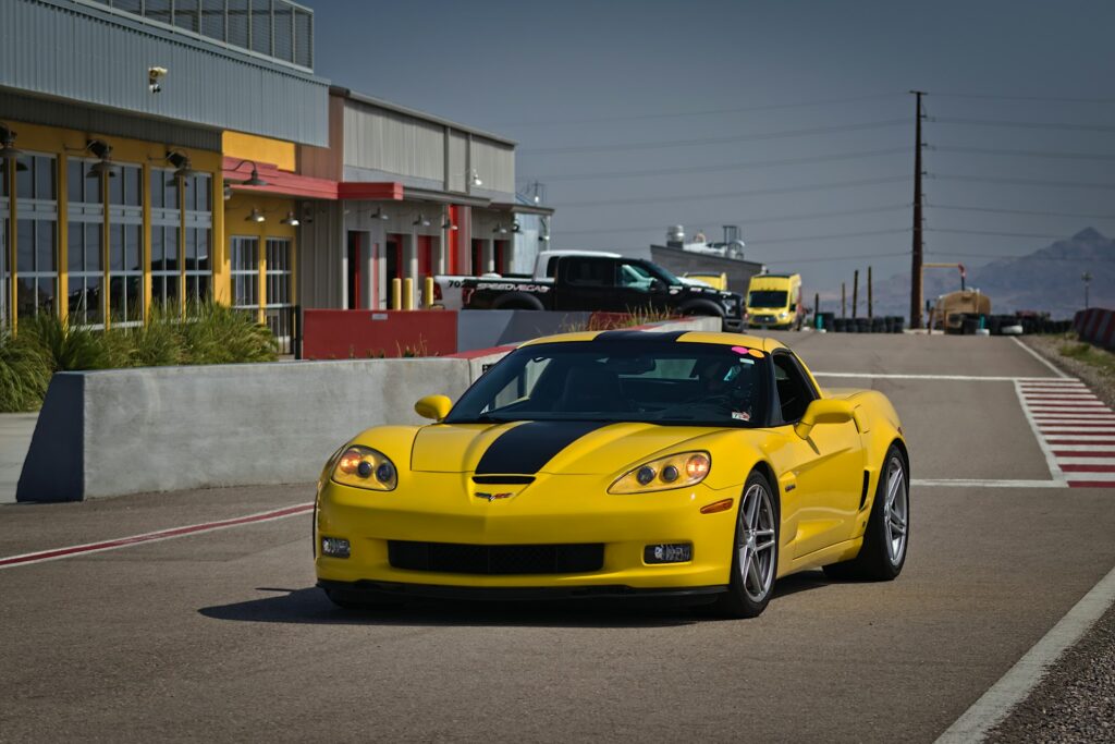 Yellow sports car with a black racing stripe