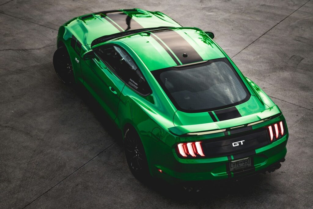 overhead shot of a Green GT with black racing stripes