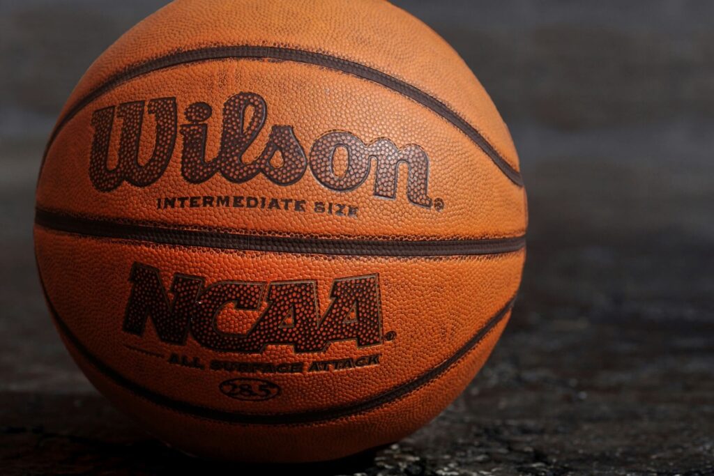A Wilson basketball with the NCAA logo.