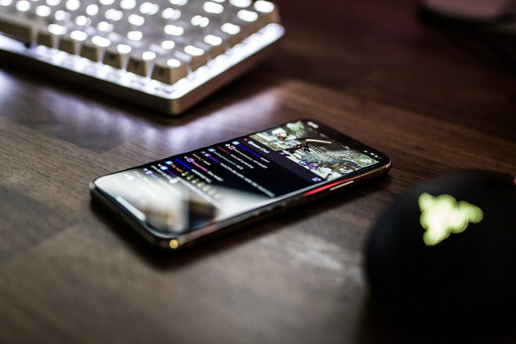 Smartphone displays a live stream while sitting on desk