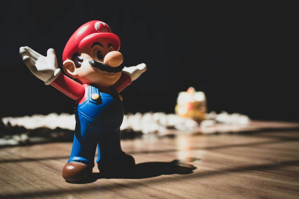 A Mario toy standing on a table