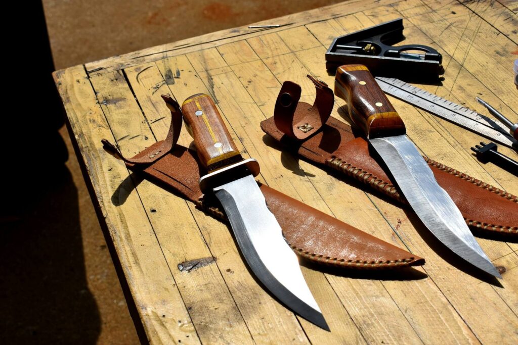 Two survival knives with wooden handles