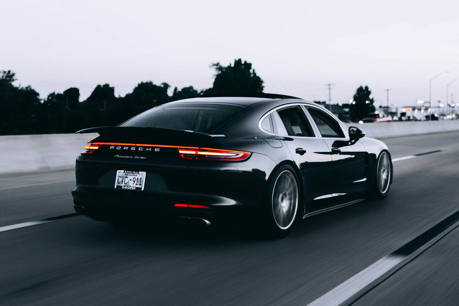 Black Porsche on the highway