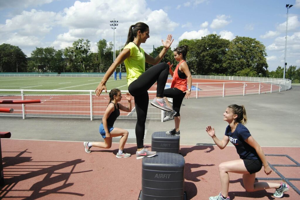 Women working out near a track