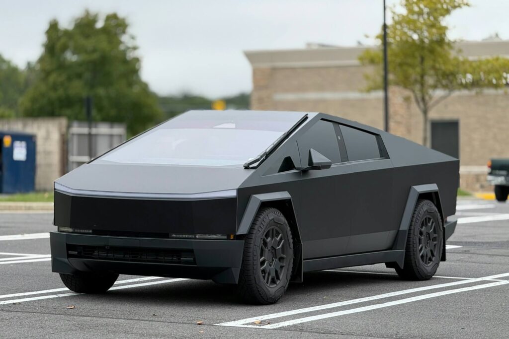 A black Cybertruck in a parking lot