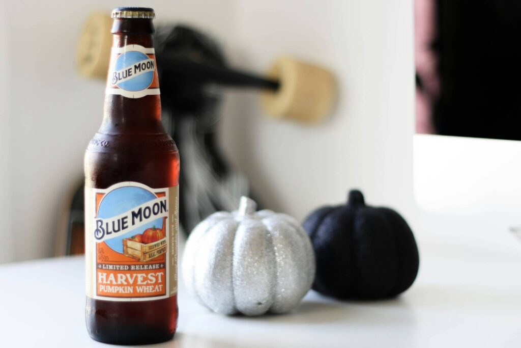 Bottle of Blue Moon Harvest Pumpkin Wheat on a white table