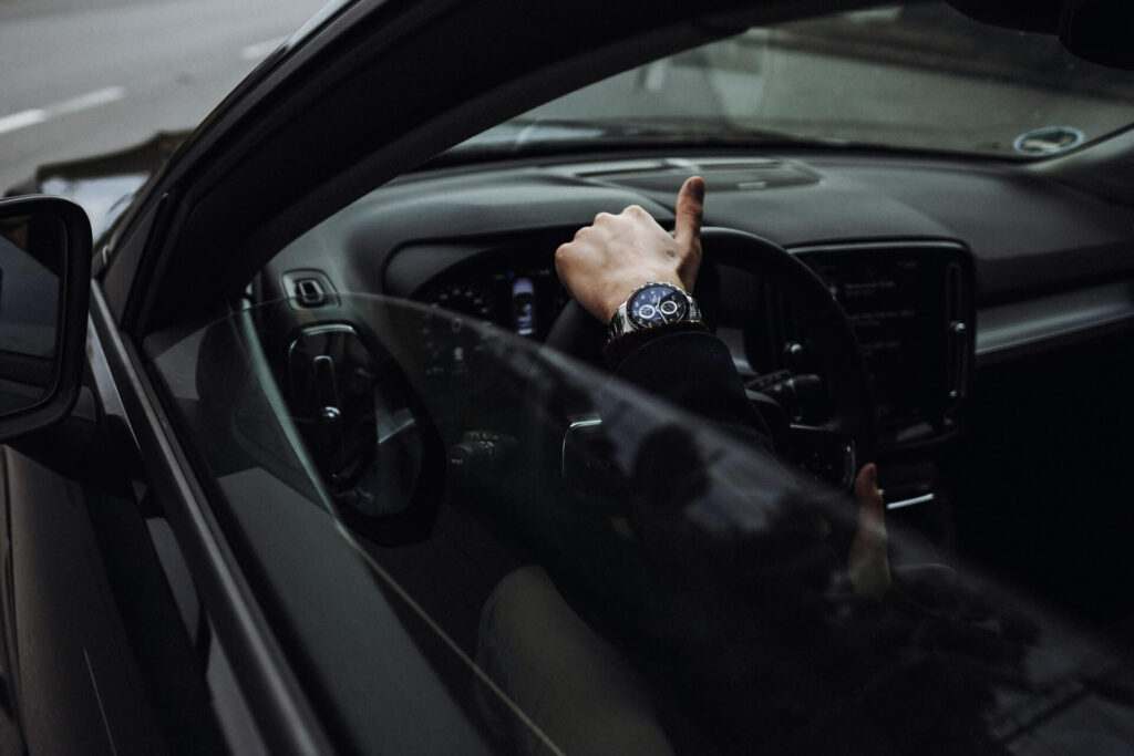 Hand holding a steering wheel